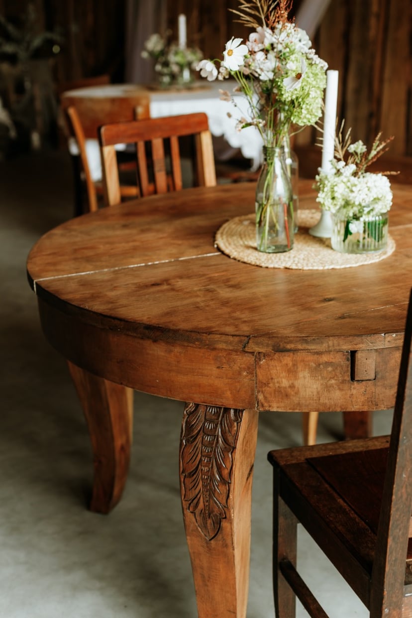 Restored wooden table with floral centerpiece - final result